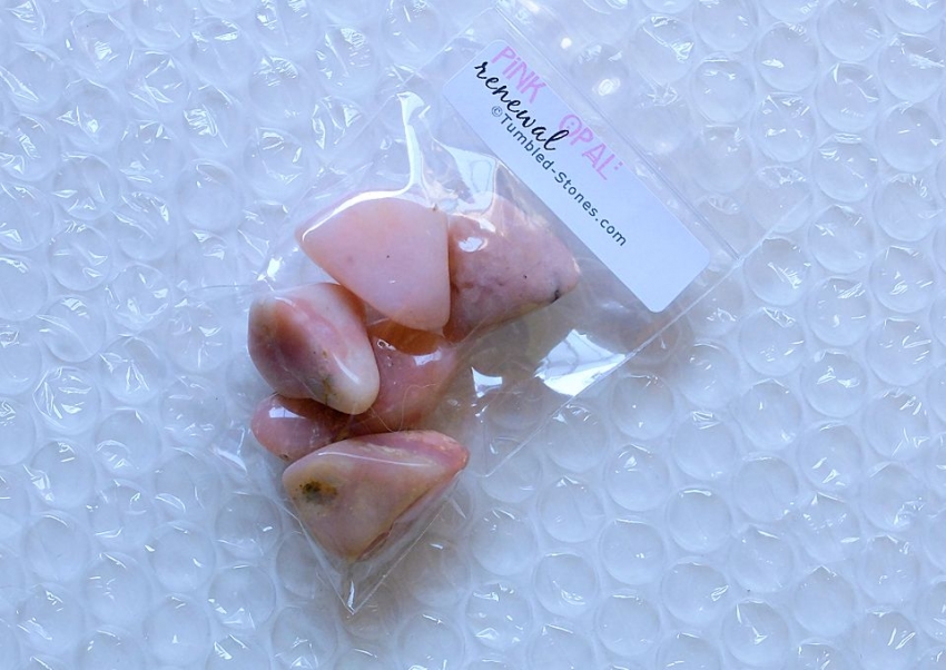 pink opal tumbled stones in bag